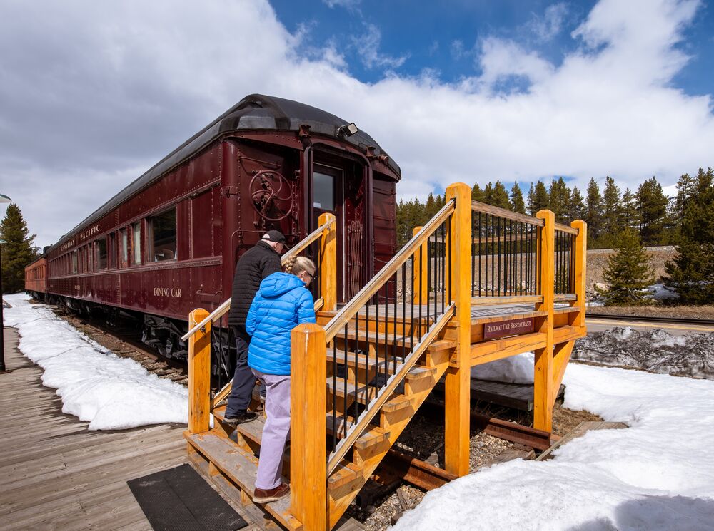 Travelers entering The Station Restaurant in Lake Louise Restored Delamere Dining Car for a private dinner